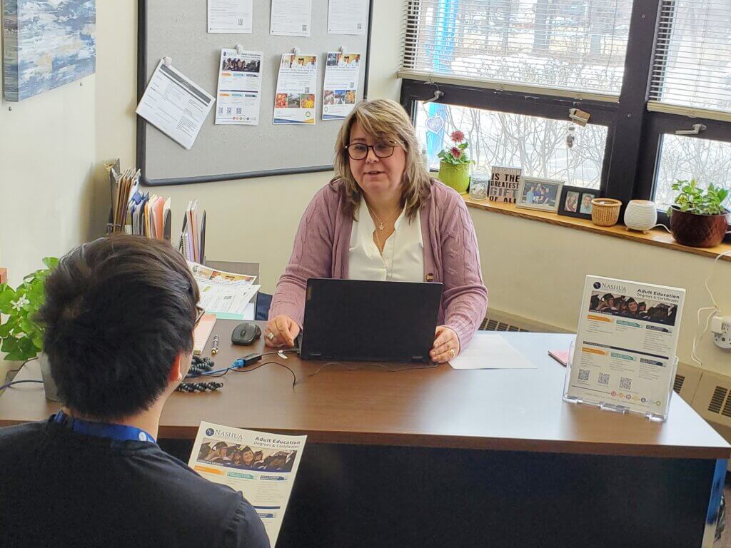 Kim Eckenrode meets with a continuing education student