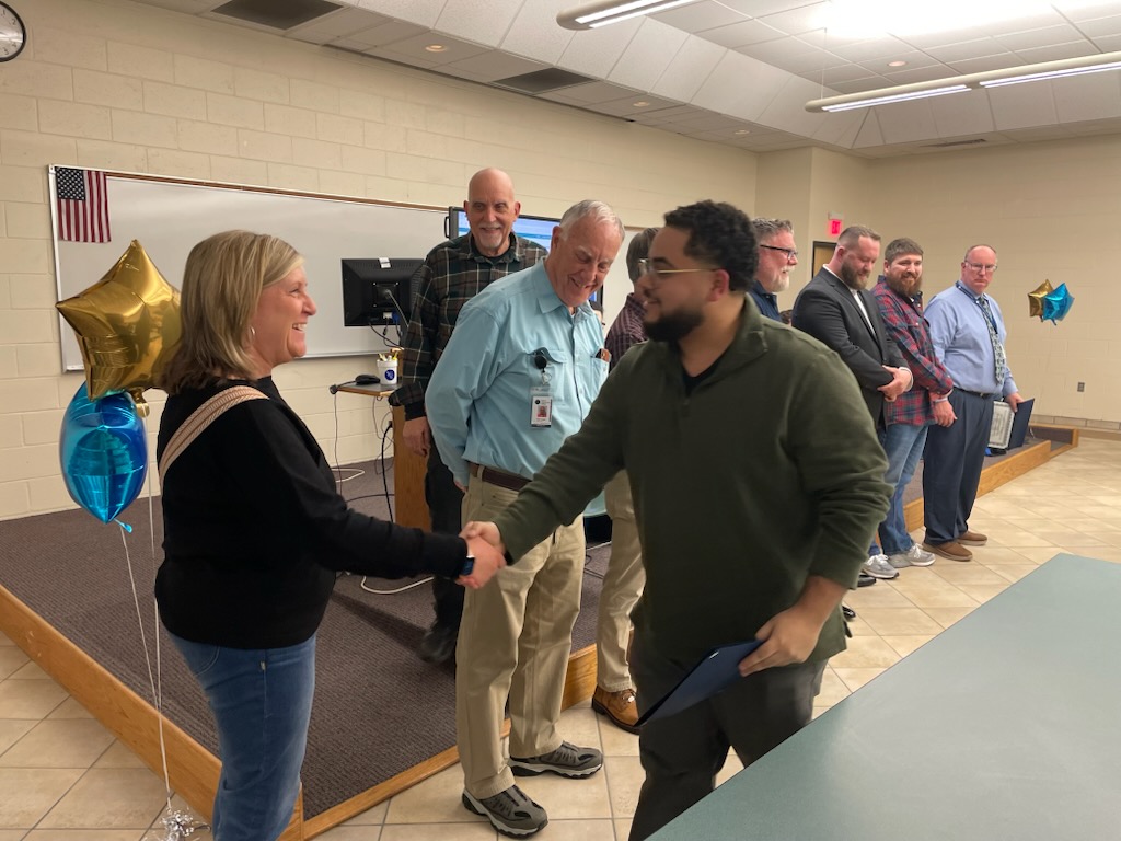 Precision Manufacturing students receive their certificates during graduation April 10, 2025 at Nashua Community College.