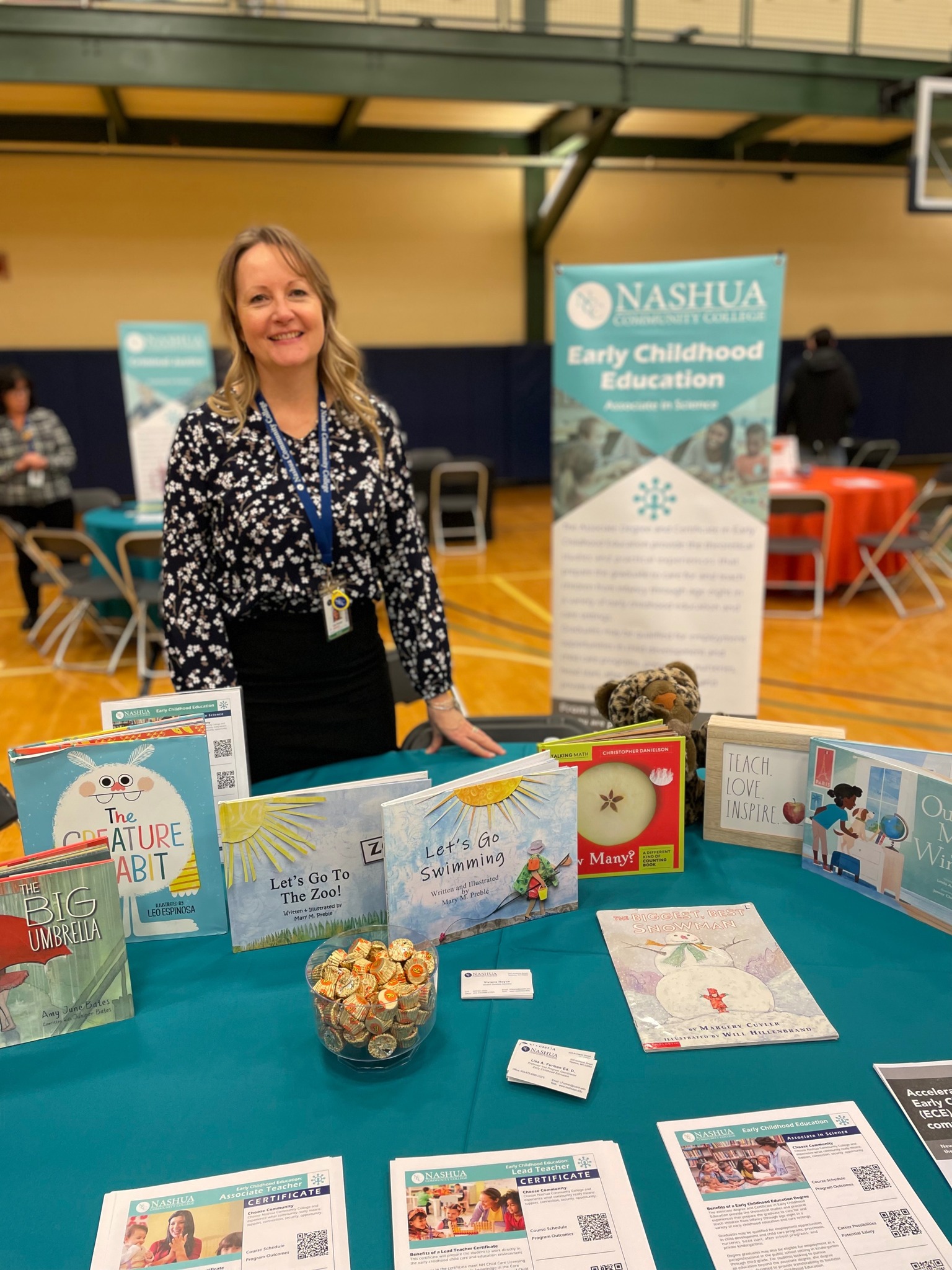 Professor Lisa Furman at the Early Childhood Education table at an NCC Open House event