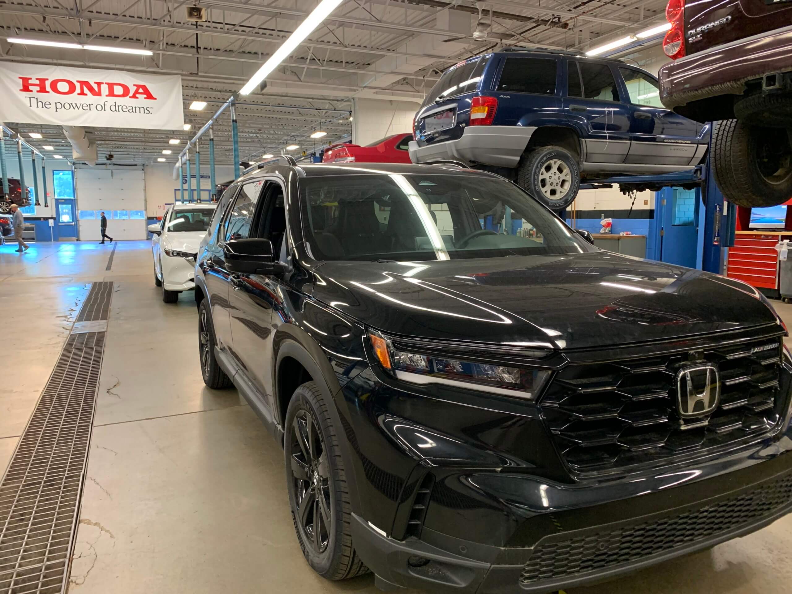 A black Honda SUV parked in the NCC auto lab
