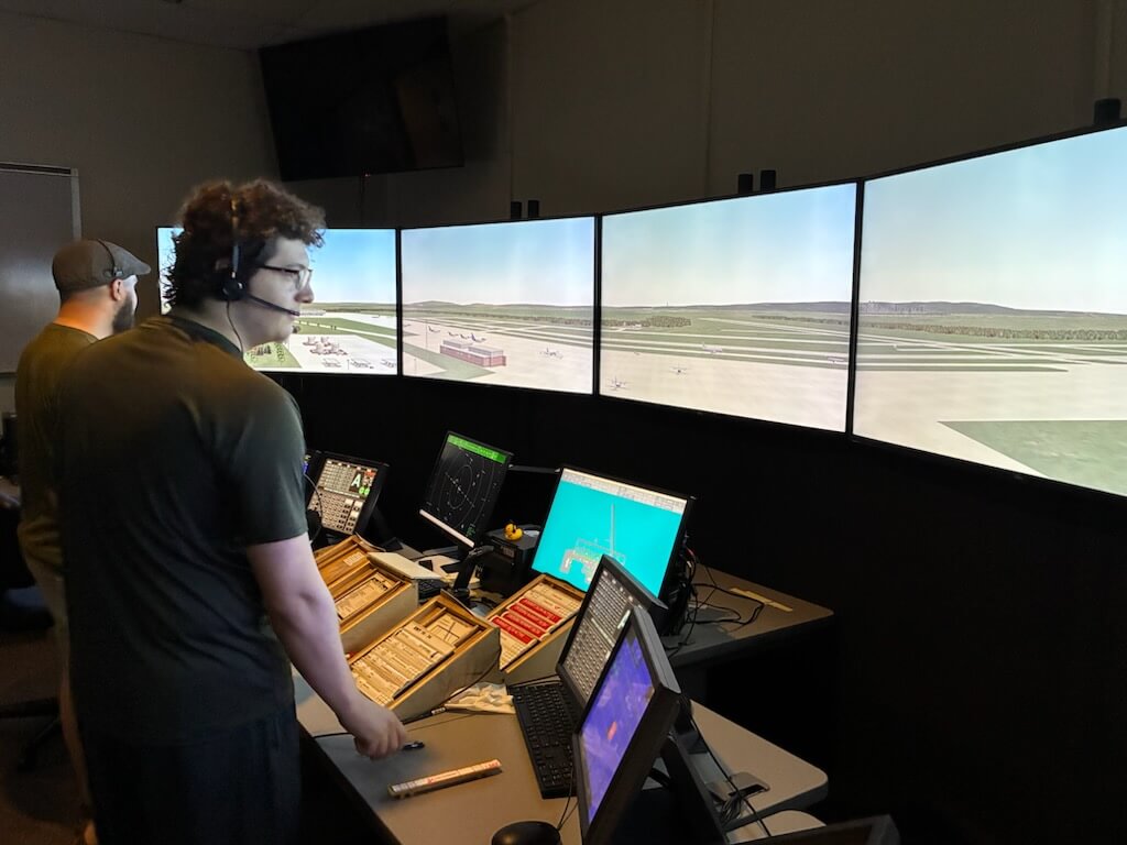 Two air traffic control students practice on the Tower Simulator at NCC